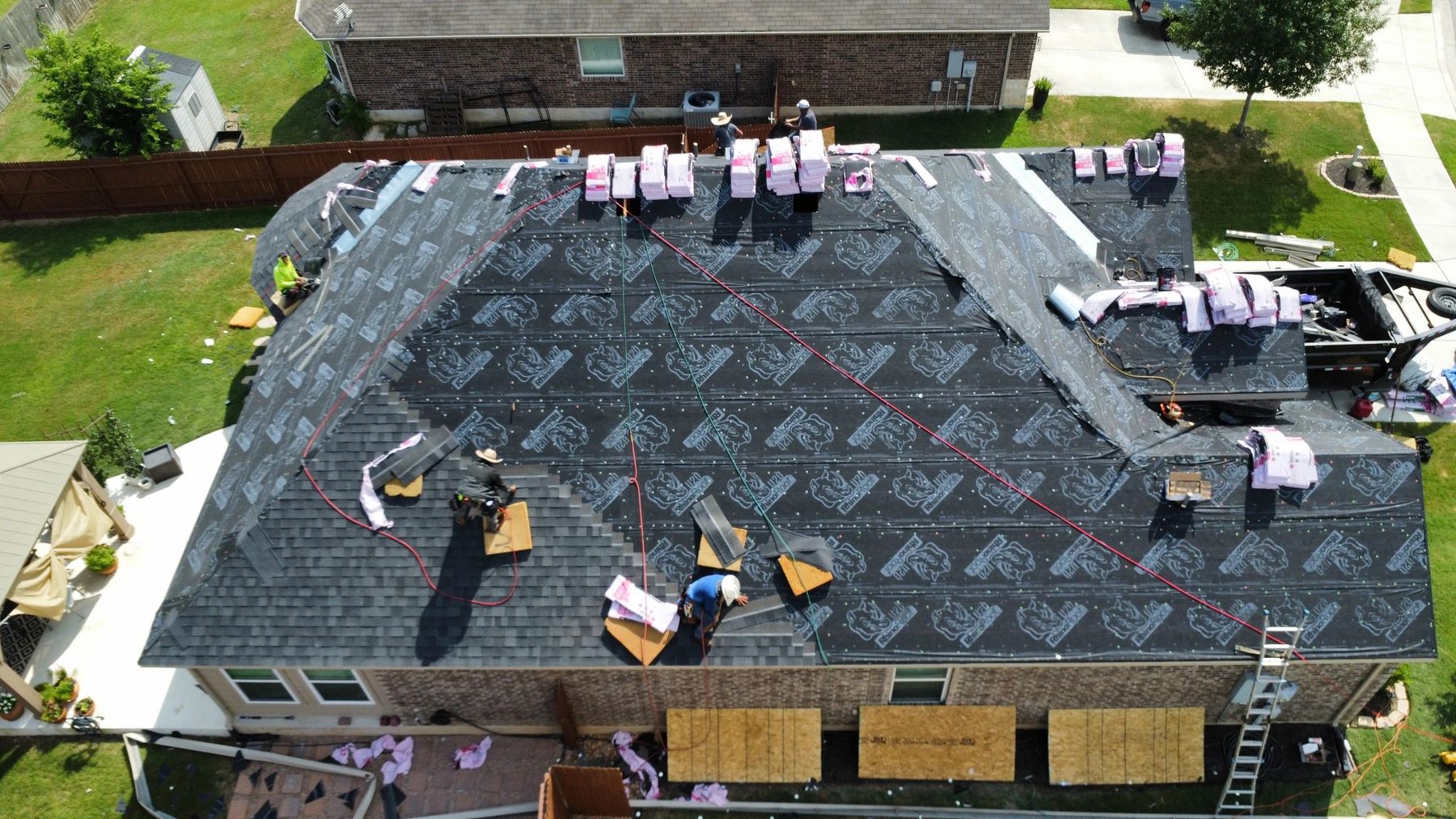 CTR crew installing architectural shingles over synthetic underlayment on a Schertz-area home