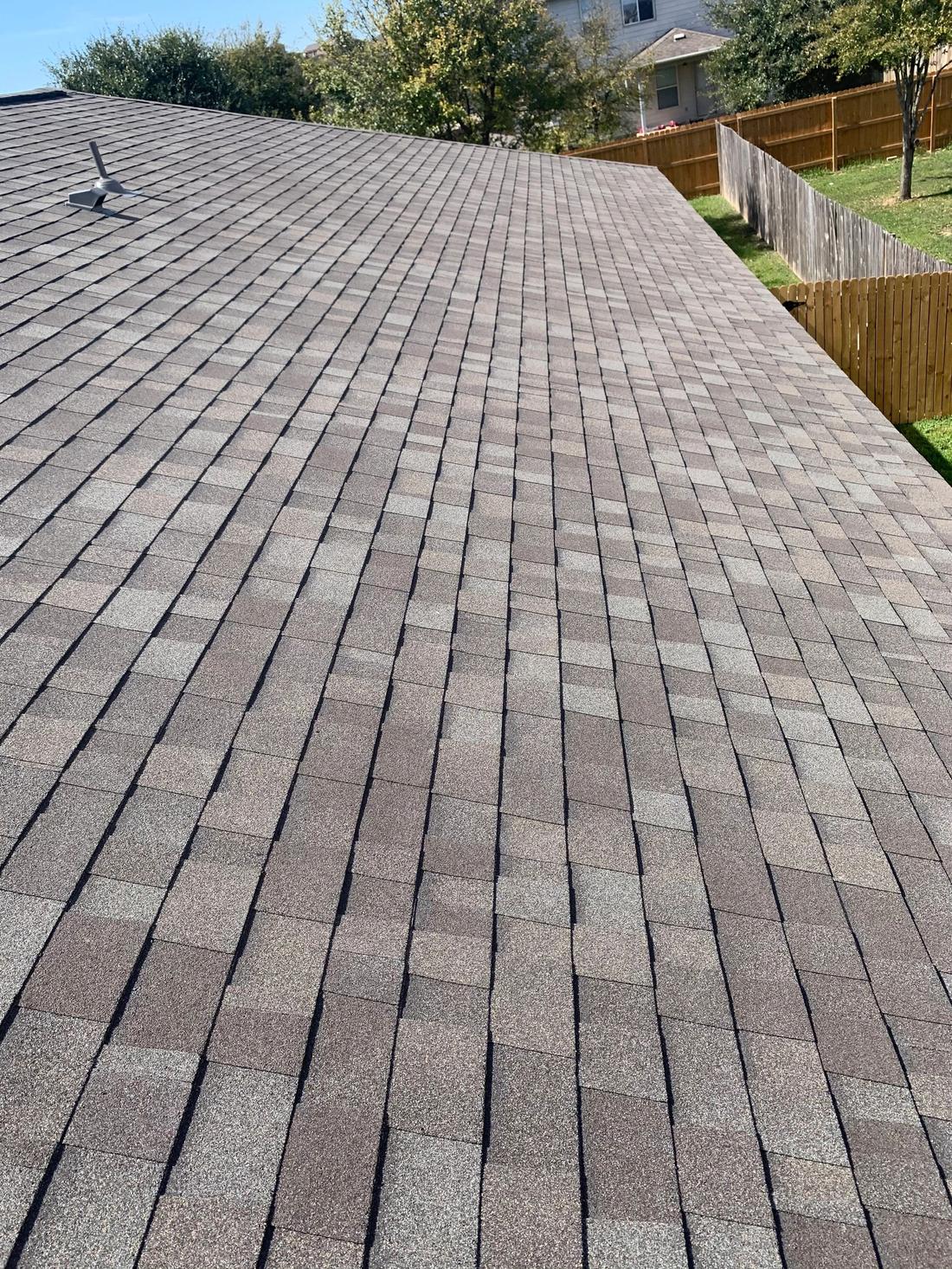 Finished architectural shingle roof with clean vent flashing