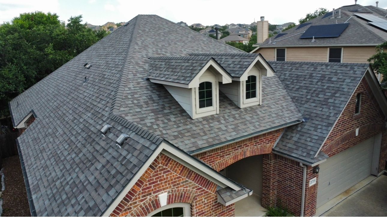 Completed multi-plane residential roof in a Schertz-area neighborhood